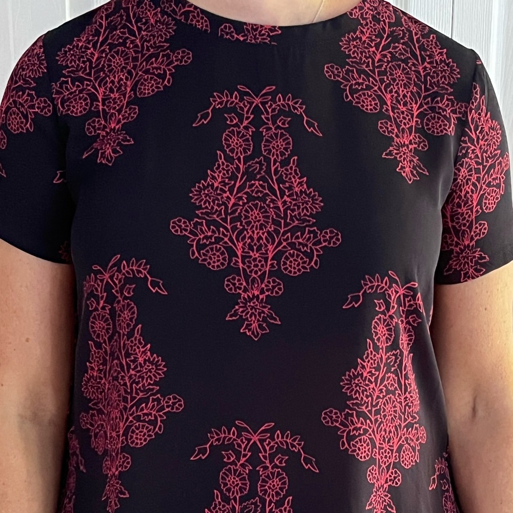 Navy blue loft shirt with red design throughout